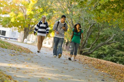 Students walking across campus on a Fall Day